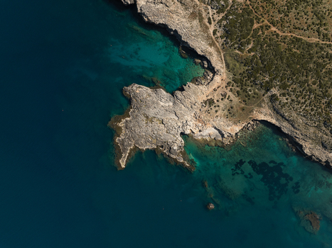 Aerial view of the rugged rocky coastline and turquoise waters of the Plemmirio Marine Protected Area Plemmirio Sicily Italy. Aerial view of the rugged rocky coastline and turquoise waters of the Plemmirio Marine Protected Area Plemmirio Sicily Italy.