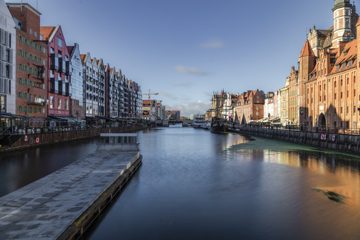 Gdansk Poland 06 September 2026 View of the Motlawa River flowing through the historic Old Town featuring colorful merchant houses traditional architecture and calm water. Gdansk Poland 06 September 2026 View of the Motlawa River flowing through the historic Old Town featuring colorful merchant houses traditional architecture and calm water.