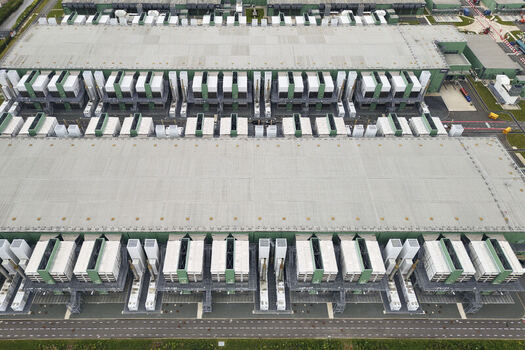 Middenmeer Netherlands 15 June 2026 Aerial view of the Microsoft Datacenter at AMS campus Agriport featuring large industrial buildings with cooling systems and power plants.