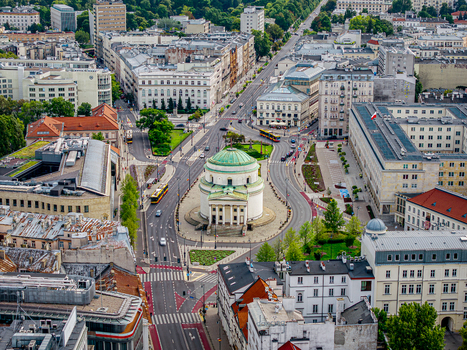 Aerial view of St. Alexander s Church and Three Crosses Square in Warsaw with historic buildings and city traffic in Poland. Aerial view of St. Alexander s Church and Three Crosses Square in Warsaw with historic buildings and city traffic in Poland.
