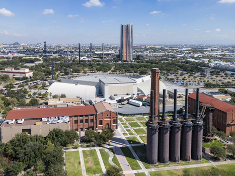Aerial view of Fundidora Park featuring historic brick chimneys and industrial architecture surrounded by green spaces and the urban skyline in Monterrey Nuevo Leon Mexico. Aerial view of Fundidora Park featuring historic brick chimneys and industrial architecture surrounded by green spaces and the urban skyline in Monterrey Nuevo Leon Mexico.