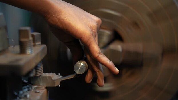 View of a worker operating a lathe machine Bangladesh. View of a worker operating a lathe machine Bangladesh.