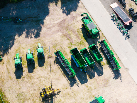 Kekava Latvia 05 July 2026 Aerial view of agricultural machinery and tractors parked at a farm equipment supplier yard. Kekava Latvia 05 July 2026 Aerial view of agricultural machinery and tractors parked at a farm equipment supplier yard.