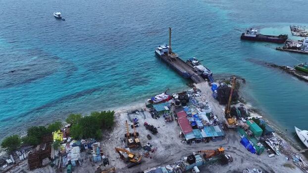 Aerial view of industrial construction site and barges in Gulhi Maldives. Aerial view of industrial construction site and barges in Gulhi Maldives.