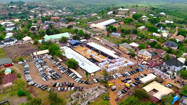 Aerial view of a large event with white tents Nigeria. Aerial view of a large event with white tents Nigeria.