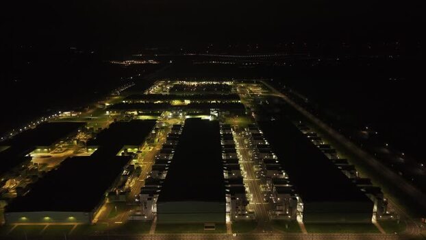 Aerial view of a data center illuminated at night Netherlands.
