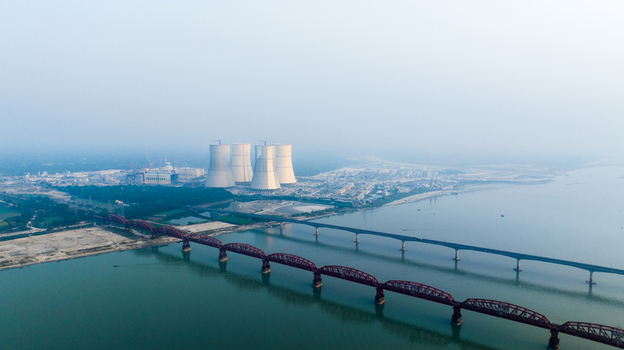Aerial view of the Rooppur Nuclear Power Plant with its large cooling towers situated near the historic Hardinge Bridge over the Padma River in Pabna Rajshahi Division Bangladesh.