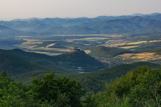 Aerial view of Fuzer Castle perched on a volcanic hill surrounded by the lush Zemplen Mountains with rolling green hills and forests Fuzer Borsod Abauj Zemplen Hungary. Aerial view of Fuzer Castle perched on a volcanic hill surrounded by the lush Zemplen Mountains with rolling green hills and forests Fuzer Borsod Abauj Zemplen Hungary.