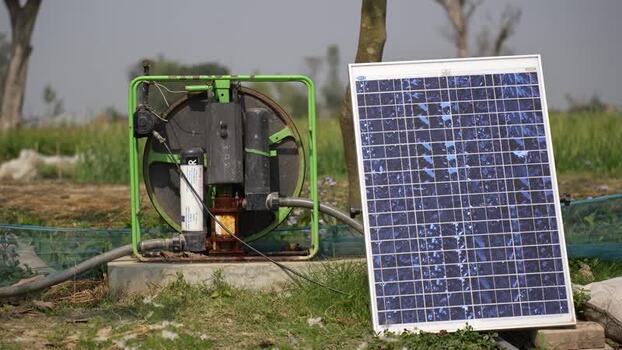 View of a solar powered water pump in a rural field Nepal.