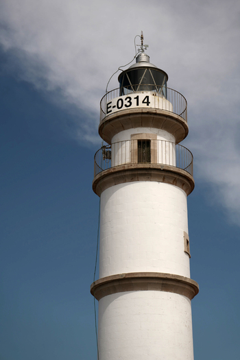 View of the white lighthouse in Mallorca Balearic Islands Spain.