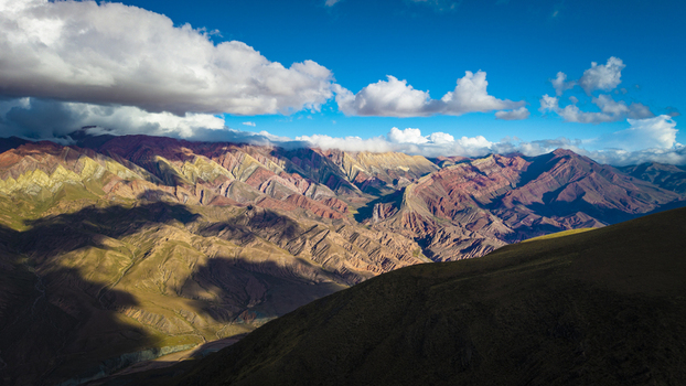 Aerial view of the colorful Serrania de Hornocal mountains with dramatic shadows and clouds in Humahuaca Jujuy Province Argentina. Aerial view of the colorful Serrania de Hornocal mountains with dramatic shadows and clouds in Humahuaca Jujuy Province Argentina.
