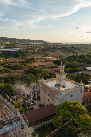 Mgarr Northern Region Malta 17 September 2026 Aerial view of Castello Zamittello with a crowd of people attending an outdoor event in the grounds set against a rural landscape. Mgarr Northern Region Malta 17 September 2026 Aerial view of Castello Zamittello with a crowd of people attending an outdoor event in the grounds set against a rural landscape.