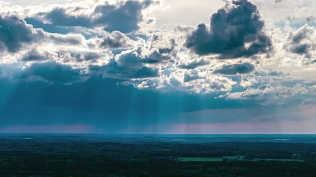 Aerial view of dramatic sunbeams over the landscape of Latvia. Aerial view of dramatic sunbeams over the landscape of Latvia.