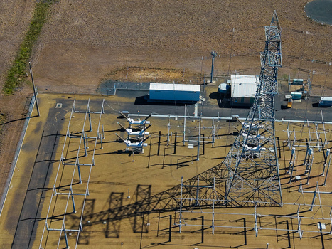Aerial view of Millmerran Power Station showing electrical infrastructure transmission towers and equipment in Domville Queensland Australia. Aerial view of Millmerran Power Station showing electrical infrastructure transmission towers and equipment in Domville Queensland Australia.