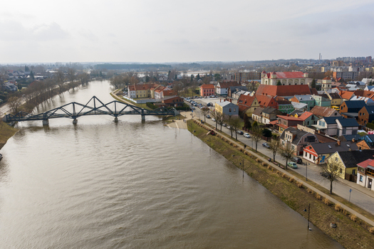 Kedainiai Lithuania 17 March 2026 Aerial view of the Nevezis river flowing through the historic old town with its colorful houses a church and a modern pedestrian bridge. Kedainiai Lithuania 17 March 2026 Aerial view of the Nevezis river flowing through the historic old town with its colorful houses a church and a modern pedestrian bridge.