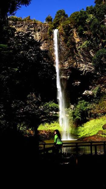 View of Bridal Veil Falls and a person New Zealand.