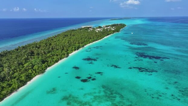 Aerial view of Fulhadhoo island and coral reefs Maldives. Aerial view of Fulhadhoo island and coral reefs Maldives.