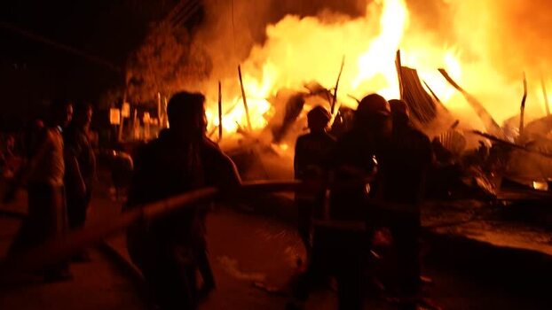 View of a massive fire at night in Khagrachari Bangladesh. View of a massive fire at night in Khagrachari Bangladesh.