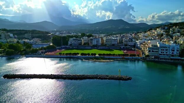 Aerial view of Crete coastal town with stadium Greece.