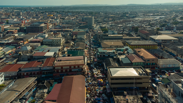Accra Greater Accra Region Ghana 26 May 2023 Aerial view of the bustling Makola Market featuring dense urban architecture colorful market stalls and crowded streets. Accra Greater Accra Region Ghana 26 May 2023 Aerial view of the bustling Makola Market featuring dense urban architecture colorful market stalls and crowded streets.