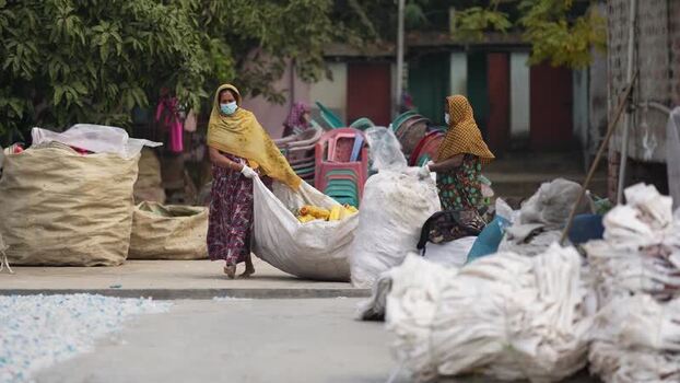 View of women sorting plastic waste in Jashore Bangladesh. View of women sorting plastic waste in Jashore Bangladesh.