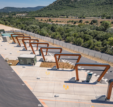 Malataverne Auvergne Rhone Alpes France 06 July 2026 Aerial view of the Milence electric truck charging hub with wooden structures and concrete bays at a logistics facility.
