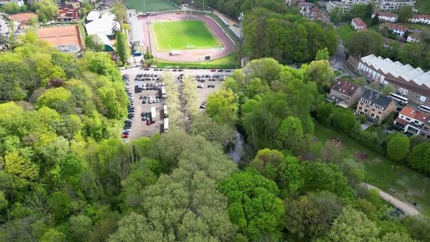 Aerial view of a sports stadium and parking lot in Belgium. Aerial view of a sports stadium and parking lot in Belgium.