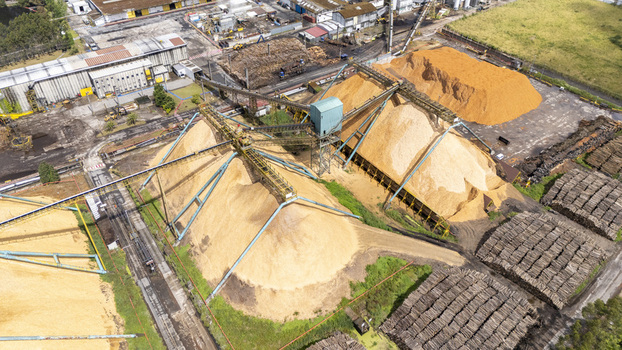 Aerial view of Biofabrica de Ence with large piles of wood chips and industrial conveyor systems Pontevedra Pontevedra Spain. Aerial view of Biofabrica de Ence with large piles of wood chips and industrial conveyor systems Pontevedra Pontevedra Spain.