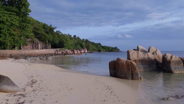 Aerial view of Praslin beach with granite boulders Seychelles.