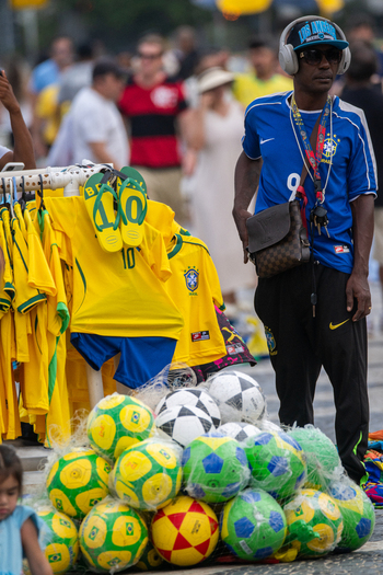 Rio de Janeiro Brazil 13 June 2026 View of a street vendor standing next to a display of Brazil national football team jerseys and soccer balls during the World Cup 2026.