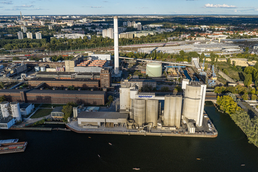 Berlin Germany 21 September 2026 Aerial view of the Spenner concrete plant by the river featuring industrial silos a tall chimney and urban infrastructure. Berlin Germany 21 September 2026 Aerial view of the Spenner concrete plant by the river featuring industrial silos a tall chimney and urban infrastructure.
