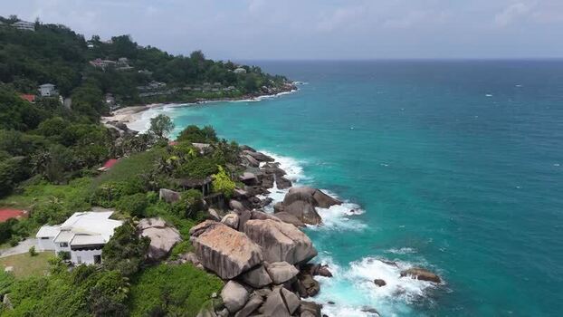 Aerial view of Mahe coastline with granite boulders Seychelles.