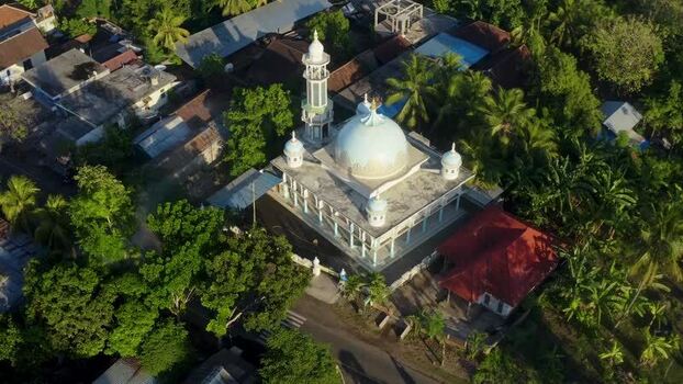 Aerial view of a mosque with a blue dome and minaret Indonesia. Aerial view of a mosque with a blue dome and minaret Indonesia.