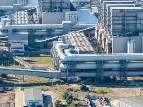 Aerial view of the Janschwalde Power Station featuring industrial infrastructure large cooling pipes and power plant buildings in Peitz Brandenburg Germany. Aerial view of the Janschwalde Power Station featuring industrial infrastructure large cooling pipes and power plant buildings in Peitz Brandenburg Germany.