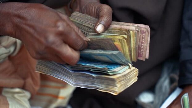 View of hands counting a stack of Bangladeshi Taka in Bangladesh. View of hands counting a stack of Bangladeshi Taka in Bangladesh.