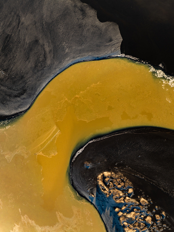 Aerial view of geothermal mineral rich water flowing through black volcanic sand in Reykjanesbaer Iceland. Aerial view of geothermal mineral rich water flowing through black volcanic sand in Reykjanesbaer Iceland.