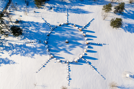 Aerial view of the stone circle at the Moletai Astronomical Observatory covered in snow with long shadows on a bright winter day Kulionys Utenos apskritis Lithuania. Aerial view of the stone circle at the Moletai Astronomical Observatory covered in snow with long shadows on a bright winter day Kulionys Utenos apskritis Lithuania.