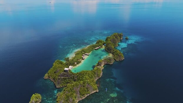 Aerial view of Rufus Reep Dive Site in Raja Ampat Regency Indonesia. Aerial view of Rufus Reep Dive Site in Raja Ampat Regency Indonesia.