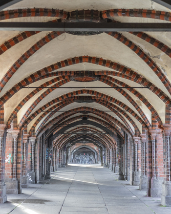 Berlin Germany 23 November 2022 View of the vaulted brick walkway of the Oberbaum Bridge with gothic revival arches and decorative ribbing. Berlin Germany 23 November 2022 View of the vaulted brick walkway of the Oberbaum Bridge with gothic revival arches and decorative ribbing.