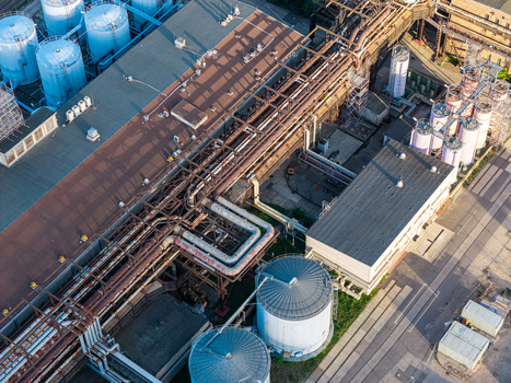 Aerial view of Heizkraftwerk Klingenberg combined heat and power plant featuring industrial pipes storage tanks and factory buildings in Berlin Berlin Germany. Aerial view of Heizkraftwerk Klingenberg combined heat and power plant featuring industrial pipes storage tanks and factory buildings in Berlin Berlin Germany.