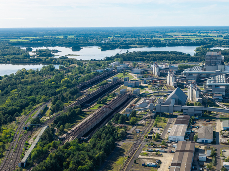 Aerial view of Janschwalde Power Plant with its industrial infrastructure railway tracks and surrounding lakes and forests in Peitz Brandenburg Germany. Aerial view of Janschwalde Power Plant with its industrial infrastructure railway tracks and surrounding lakes and forests in Peitz Brandenburg Germany.