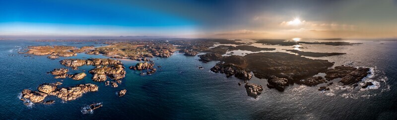Aerial view of the rugged coastline and rocky islands of Cloughglass featuring small sandy beaches and the Atlantic Ocean under a dramatic sky in Cloughglass County Donegal Ireland. Aerial view of the rugged coastline and rocky islands of Cloughglass featuring small sandy beaches and the Atlantic Ocean under a dramatic sky in Cloughglass County Donegal Ireland.