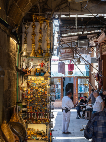 Cairo Egypt 20 April 2026 View of the historic Khan el Khalili bazaar with shops selling traditional hookahs and souvenirs along a narrow alleyway filled with people. Cairo Egypt 20 April 2026 View of the historic Khan el Khalili bazaar with shops selling traditional hookahs and souvenirs along a narrow alleyway filled with people.
