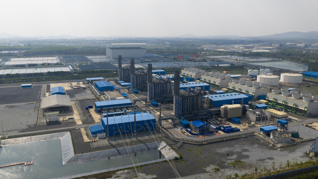 Aerial view of the Gulf Pluak Daeng GPD power plant industrial complex with cooling towers and storage tanks in Map Yang Phon Rayong Thailand.