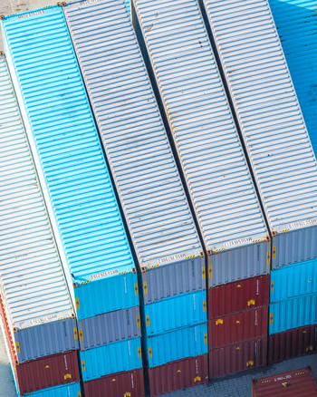 Aerial view of colorful cargo containers stacked in a shipping yard in Warsaw Masovian Voivodeship Poland.