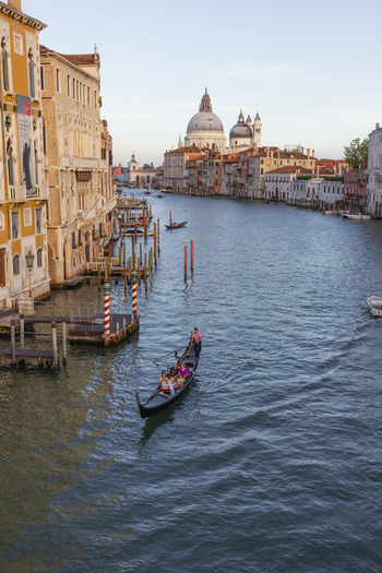 Venice Italy 21 September 2026 View of Santa Maria della Salute and a gondola on the Grand Canal with historic buildings under a clear sky. Venice Italy 21 September 2026 View of Santa Maria della Salute and a gondola on the Grand Canal with historic buildings under a clear sky.