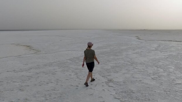 Aerial view of a woman walking on the vast Danakil Desert Ethiopia.