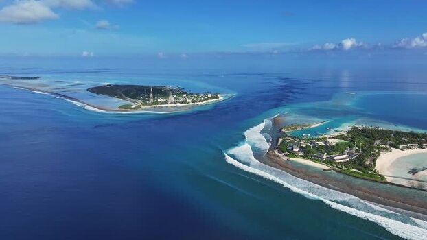 Aerial view of tropical islands and ocean channel Maldives.