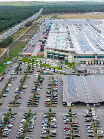 Grunheide Mark Germany 07 September 2026 Aerial view of Tesla Gigafactory Berlin Brandenburg featuring its large manufacturing facility solar roof and extensive parking lots near a forest. Grunheide Mark Germany 07 September 2026 Aerial view of Tesla Gigafactory Berlin Brandenburg featuring its large manufacturing facility solar roof and extensive parking lots near a forest.
