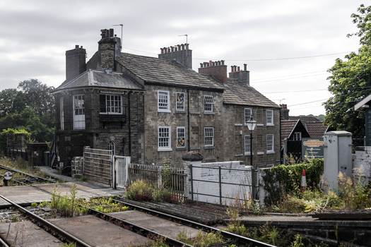 Knaresborough United Kingdom 14 July 2026 View of the historic Knaresborough railway station building with stone walls traditional sash windows and railway tracks in the foreground.